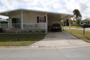 mobile home with porch and carport