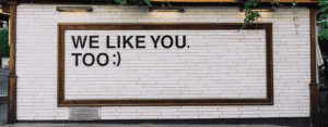 "we like you, too" sign
