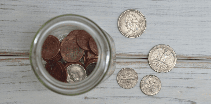 Saving coins in a glass jar