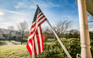 American flag on a pole of a house patio