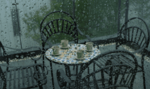 heavy rain falling on outdoor patio furniture
