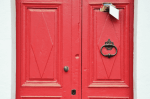 A red house door with a handle