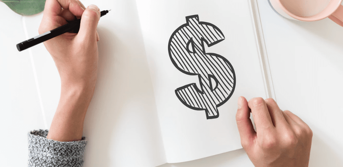 drawing of a US dollar sign in a journal