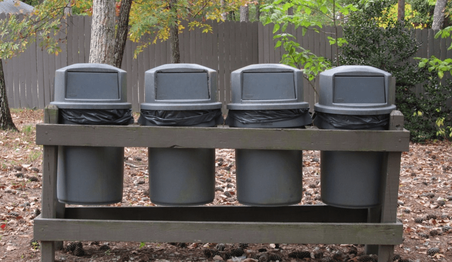 a row of neatly arranged garbage cans 