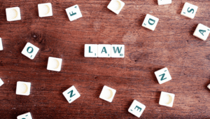 The word "law" spelled out in Scrabble tiles