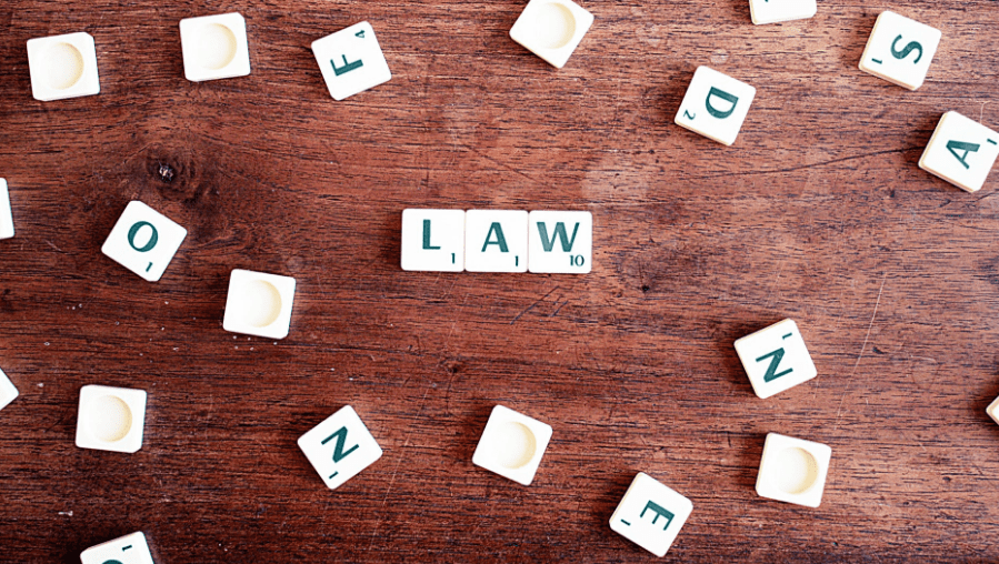The word "law" spelled out in Scrabble tiles