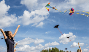 Woman and child flying kites