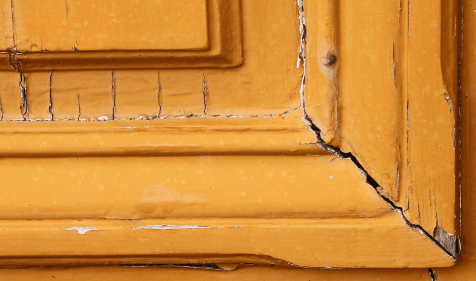 Cracks in an orange door 