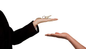 Real estate agent handing over keys