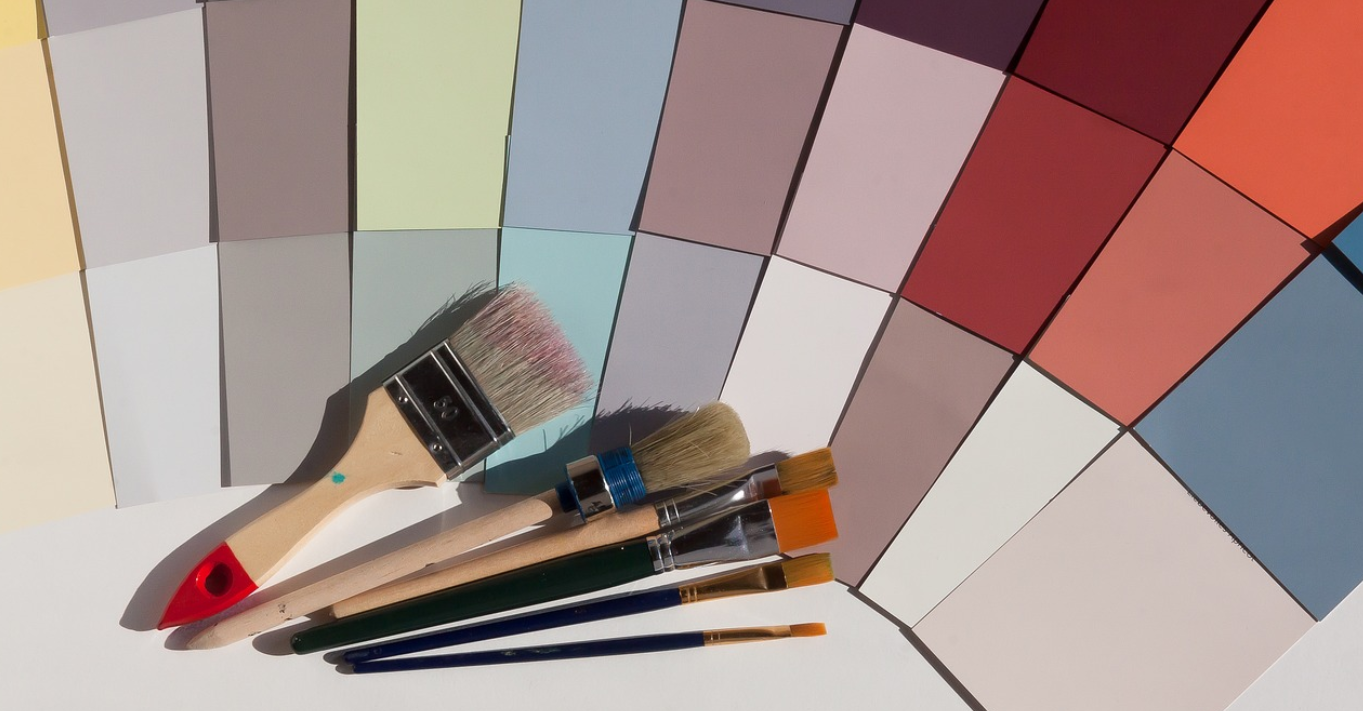 Paint brushes with a collection of color swatches