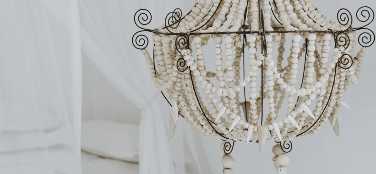 Ornate chandelier with beads in a bedroom
