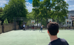 Kids playing on a basketball court