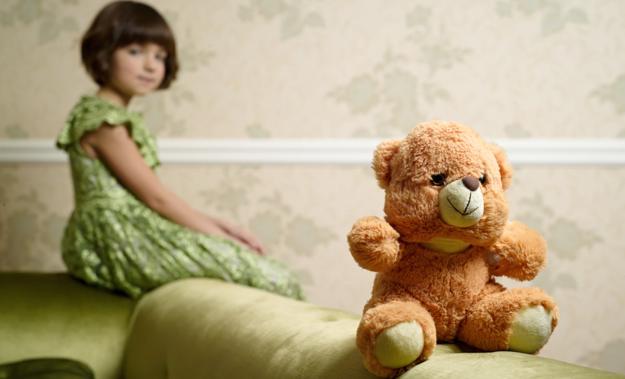 Little girl and teddy bear