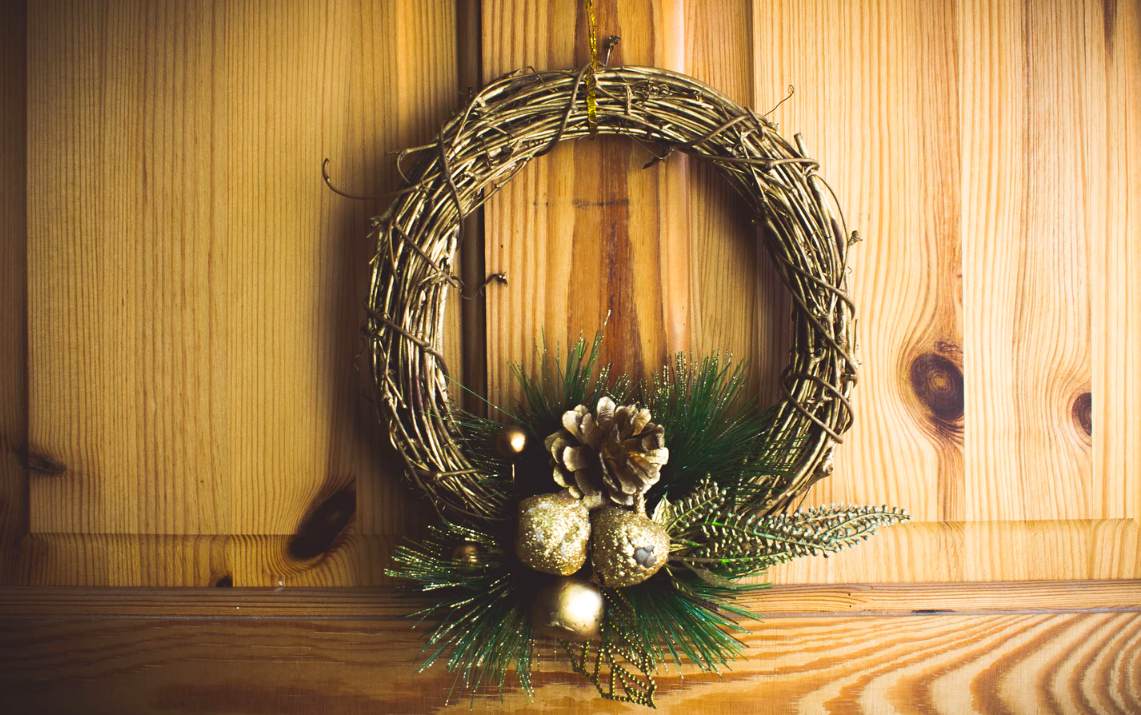 Christmas wreath hanging on cupboard doors