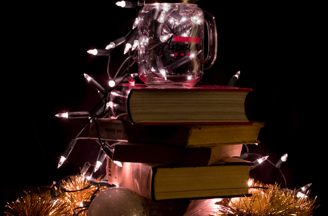 Christmas lights strung on books