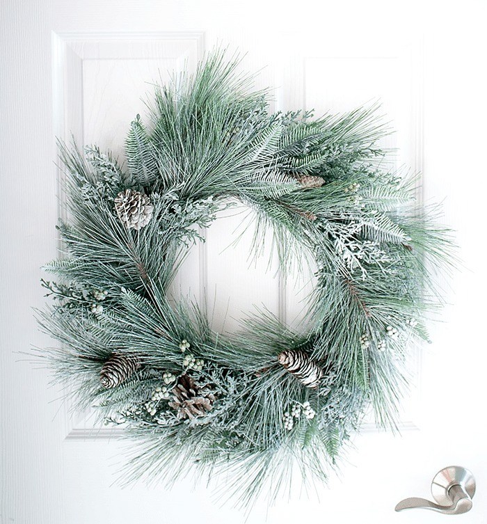 Snow sprayed frosted wreath