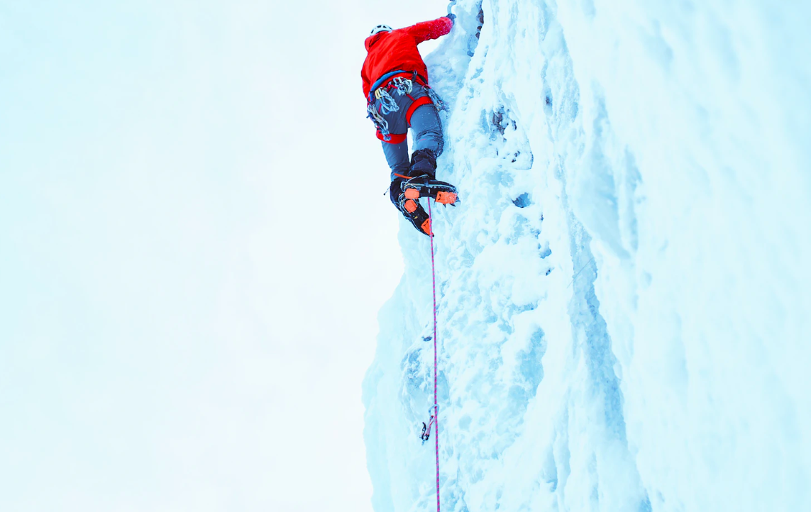 Person climbing with ice picks