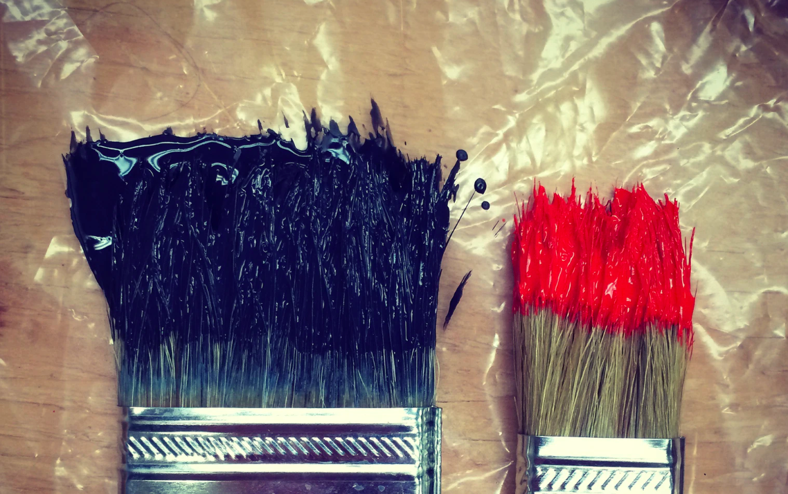 Black paintbrush, red paintbrush
