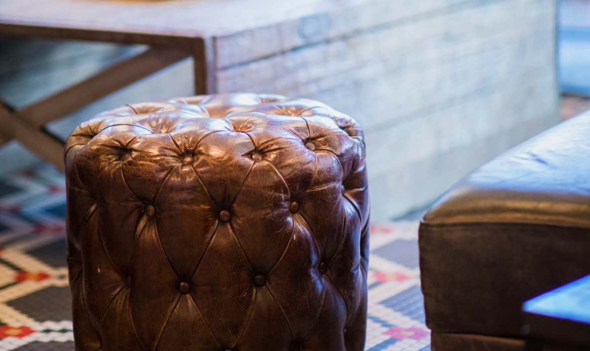 Leather tufted ottoman