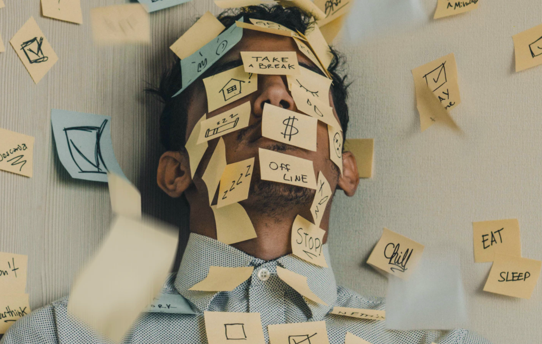 Stressed man with post-it notes