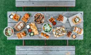 Assortment of food on outdoor table