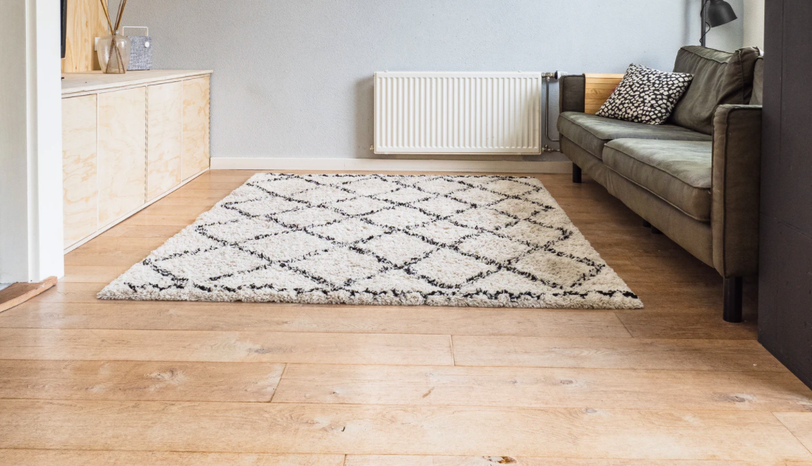 Wooden floor with rug
