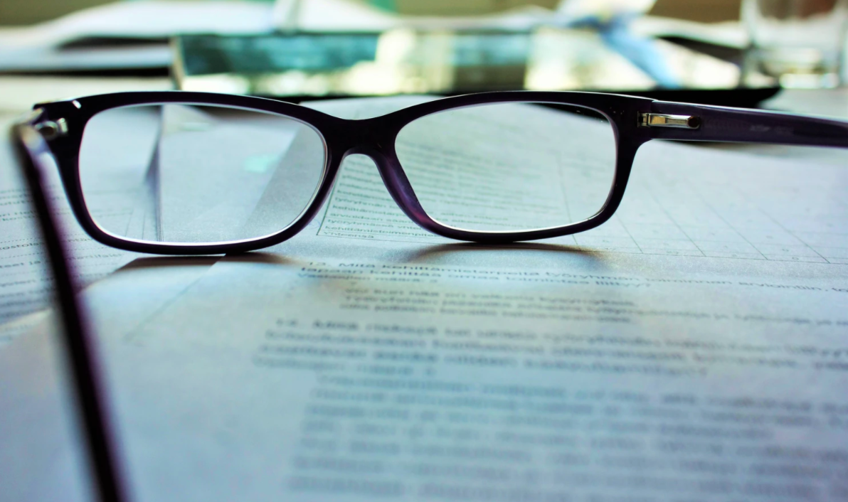 A pair of glasses on a document
